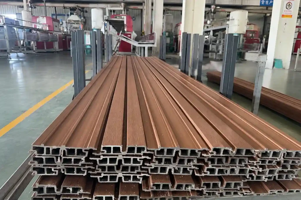 Bundles of tailor-made composite decking boards in industrial plant, demonstrating the custom dimensions and stable bulk supply capabilities of a leading WPC supplier.