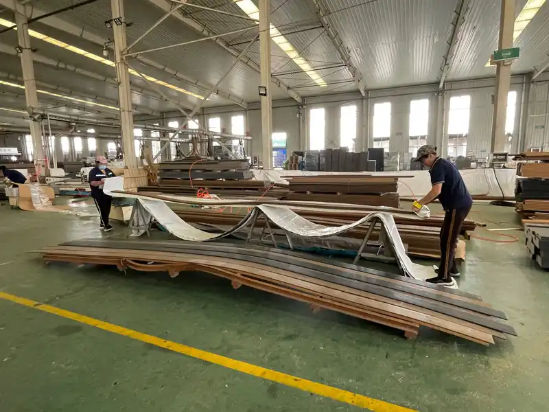 Capped composite decking OEM manufacturing process inside Supereco WPC decking factory