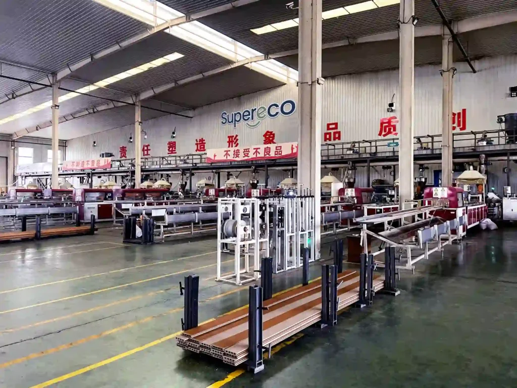Inside Supereco WPC factory workshop showing advanced outdoor composite product manufacturing and extrusion lines.