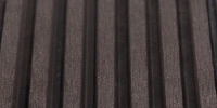 Wide stripe composite decking surface finish for modern outdoor spaces