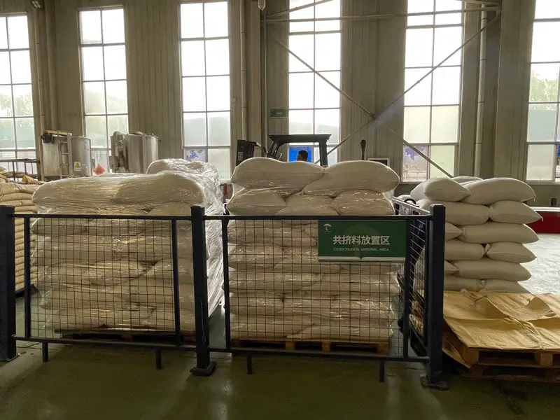 Raw materials for composite decking stored in factory warehouse