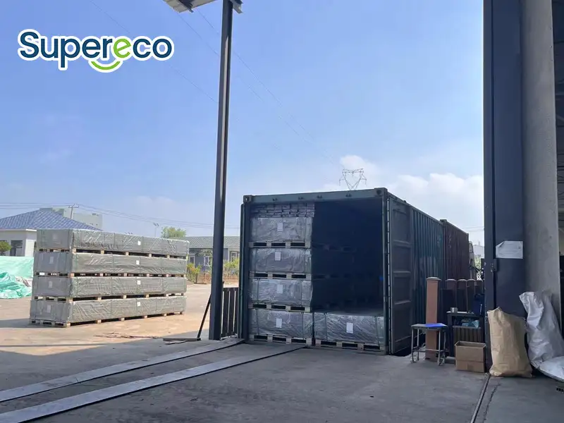 Supereco composite decking wholesale shipment being loaded into a shipping container at the factory.