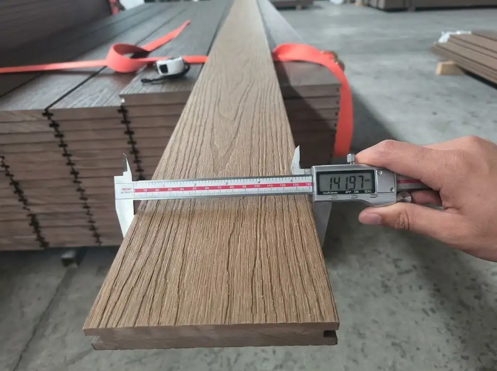 Measuring the width of a 3D wood grain plank produced by a composite decking manufacturer