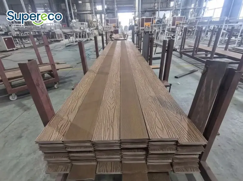 Neatly stacked 3D embossed wood plastic planks supplied by a trusted composite deck suppliers.