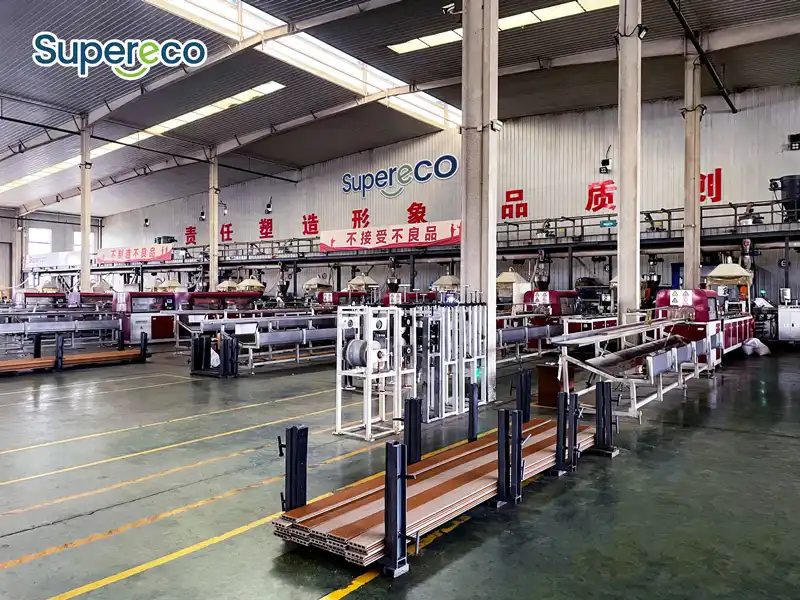 Inside Supereco WPC factory workshop showing advanced outdoor composite product manufacturing and extrusion lines.