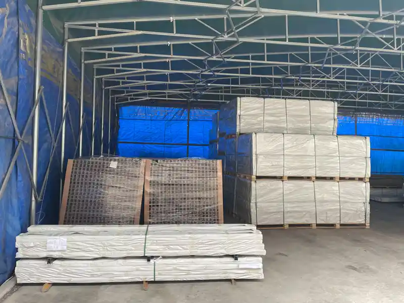 Palletized composite decking packaged securely with waterproof film inside our factory warehouse.