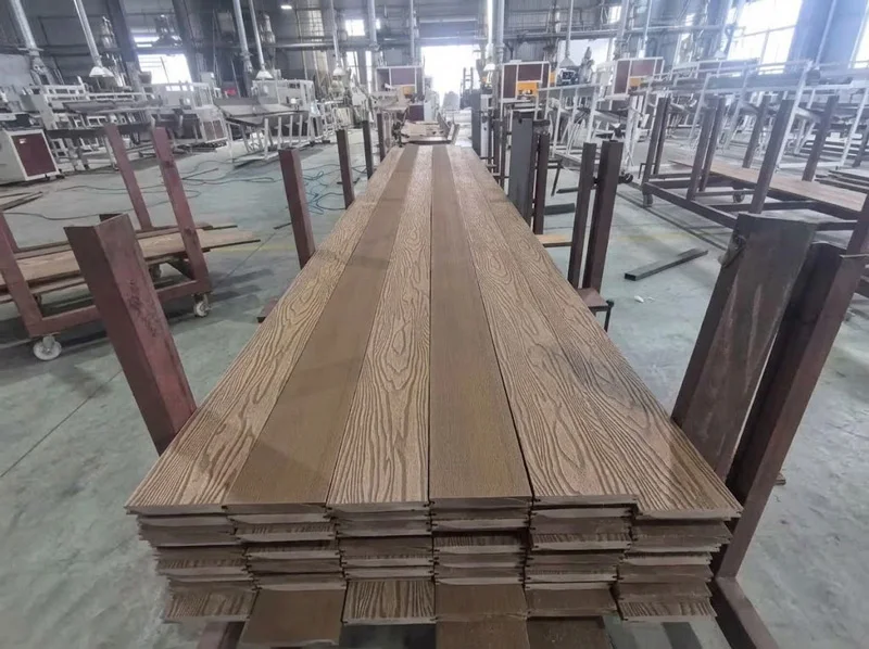 Neatly stacked 3D embossed wood plastic planks supplied by a trusted composite deck suppliers.
