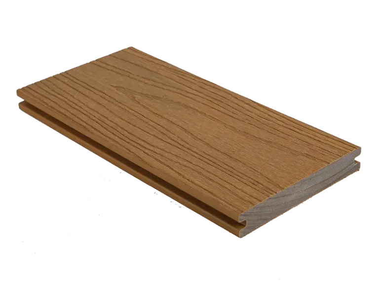 Brown solid capped composite decking board with a grooved surface